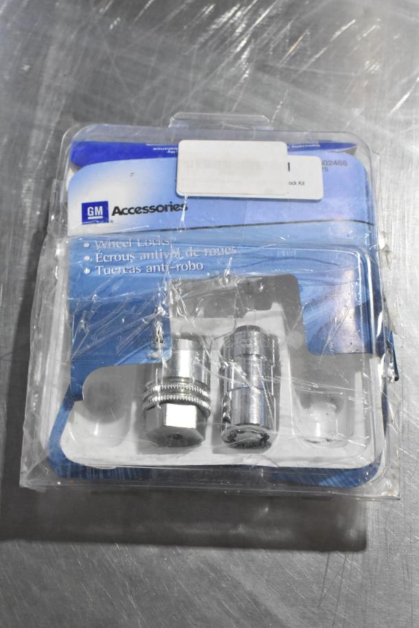 GM Wheel Locks in original packaging, featuring two chrome locks. Package labeled in English, French, and Spanish.