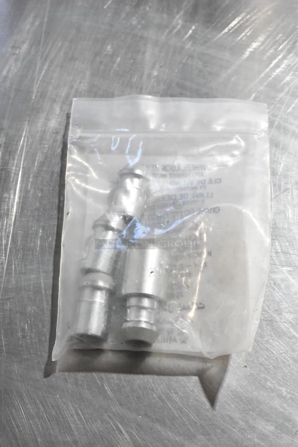 Bag containing GM wheel locks with visible text label, new condition, packaged in clear plastic.