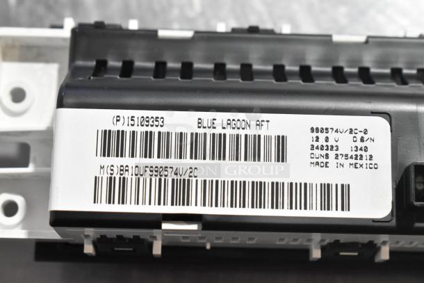 Close-up of a GM A/C and heat panel with label showing model number 15109353, indicating "Blue Lagoon AFT," 12V, made in Mexico.