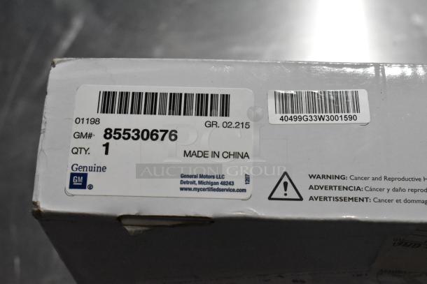 Genuine GM 85530676 Battery Tender for C6, C7, C8 Corvettes. Box label shows GM# 85530676, made in China. Warning labels visible.