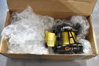 GM 85557292 yellow seat belt in box with bubble wrap, new condition, visible warning labels, durable material.