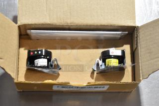 Box containing LED Puddle Light Kit, with two round lights, barcode, and labels indicating part details.