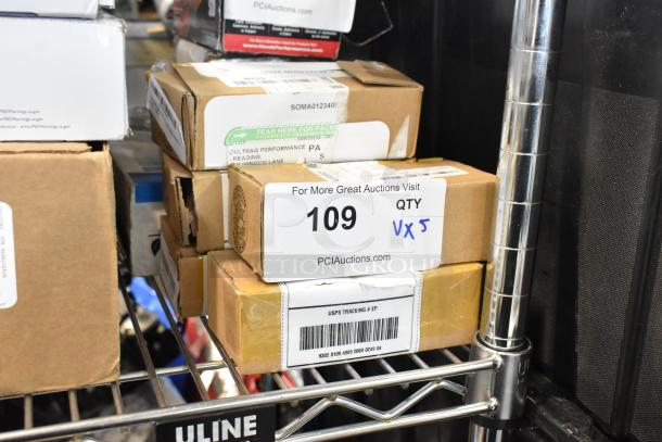 Five assorted items packed in boxes, including an LED puddle light kit. Box labeled "109 QTY VX5" from PCIAuctions.com.