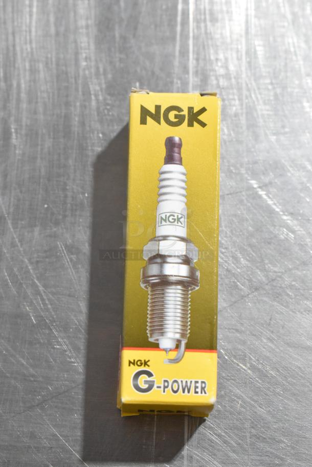 NGK BKR5EGP spark plug in original packaging, featuring G-Power branding on yellow box.