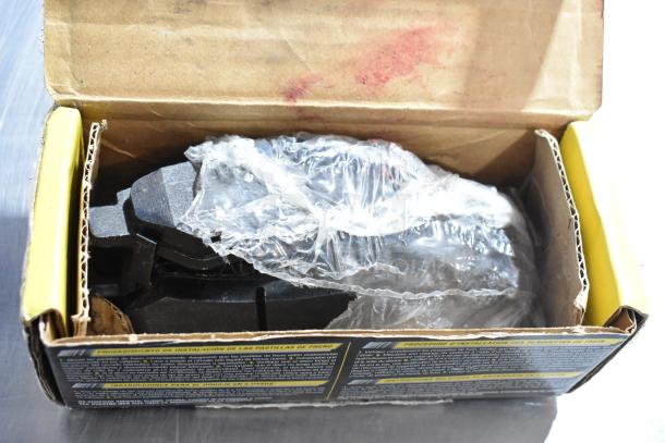Box of Hawk HB639 Z.645 ceramic brake pads, new in open packaging with visible protective wrap and installation instructions.