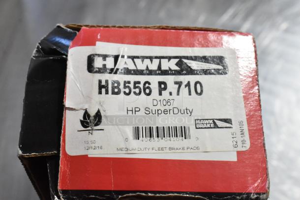 Hawk HB556 P.710 HP SuperDuty brake pads shown in original packaging with label visible. Medium duty fleet brake pads.