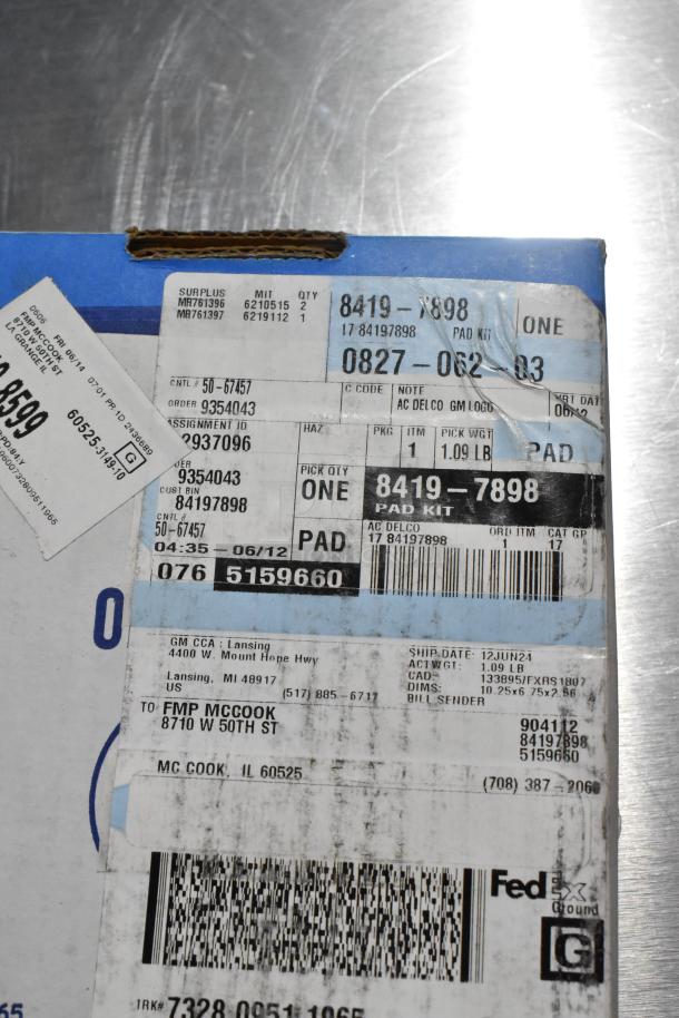 Box with shipping labels for brake pad kit, labeled "AC Delco," weighing 1.09 lbs, shipped to McCook, IL.