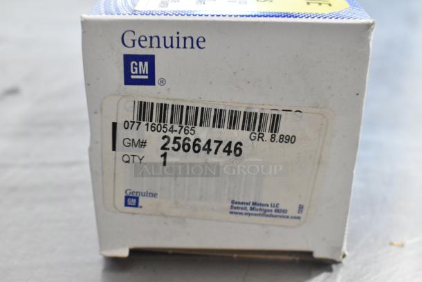 Box with GM part 25664746, label reads Genuine GM, quantity 1, item in original packaging, for auction.