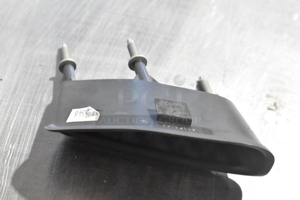 4 auto parts, including GM 25664746. Includes a black piece with two bolts and tag. Auction offers multiplier on bid.