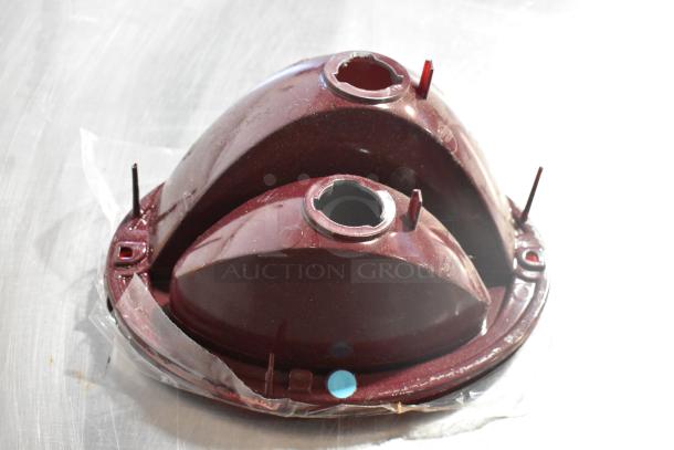 Four automotive parts including Corvette LT1 piece, X34-122-B1, GM 25664746, and GM brake light piece, pre-owned.