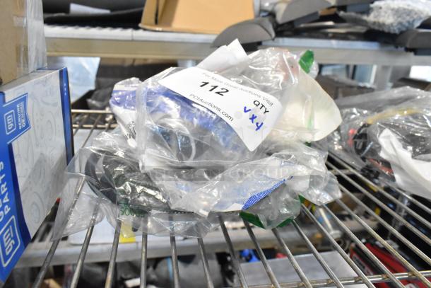 Four GM parts items include GM X21-116-D1 and reflector, in packaging on metal shelf, tag notes "QTY x4".