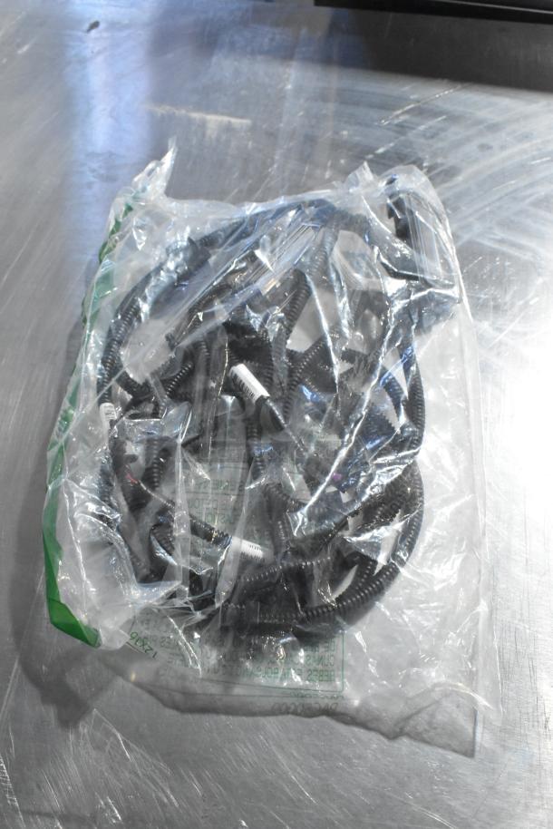 Bag containing GM X21-116-D1 wiring harness, labeled parts, and GM reflector. New condition, sealed in plastic.