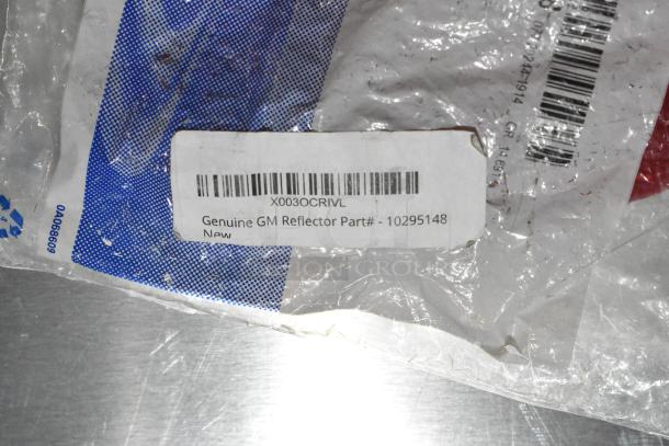 Genuine GM Reflector Part X0030CRIVL, model 10295148, in new condition with visible label and packaging.