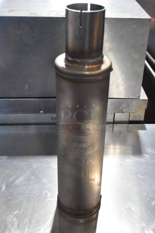 Magnavox MF Exhaust, cylindrical metal, visible markings, good condition, part of auction lot with Noco GB40 Genius Boost.