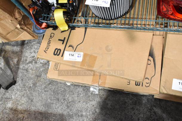 Boxes labeled with auction tags containing scratch and dent Corvette and Porsche Carrera floor mats on a warehouse shelf.