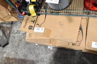 Boxes labeled with auction tags containing scratch and dent Corvette and Porsche Carrera floor mats on a warehouse shelf.