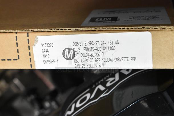 Cardboard box with Corvette floor mats label, model 3153270, GM logo, black color, new condition, minor scratches.