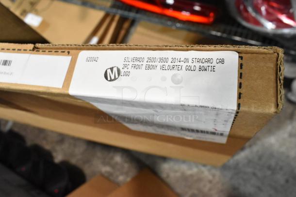 Cardboard box labeled for Silverado 2500/3500, 2pc front Ebony Velourtex floor mats, Gold Bowtie logo, new condition.