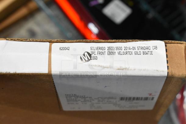 Box labeled "Silverado 2500/3500 2014-on Standard Cab 2pc Front Ebony Velourtex Gold Bowtie Logo," indicating floor mats.