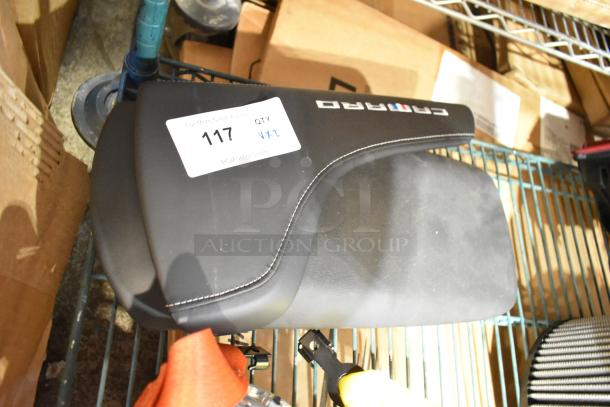 Black Camaro pad with stitching, in excellent condition, resting on a metal shelf. Label indicates lot number 117.