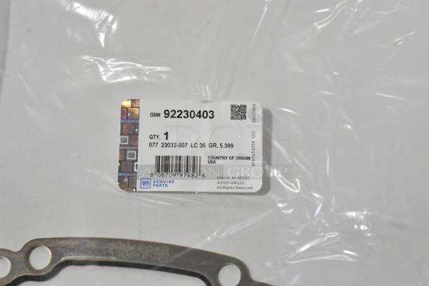 Four automotive items, including GM 23360288 wiper blade, sealed in packaging. Label with GM# 92230403, made in USA.