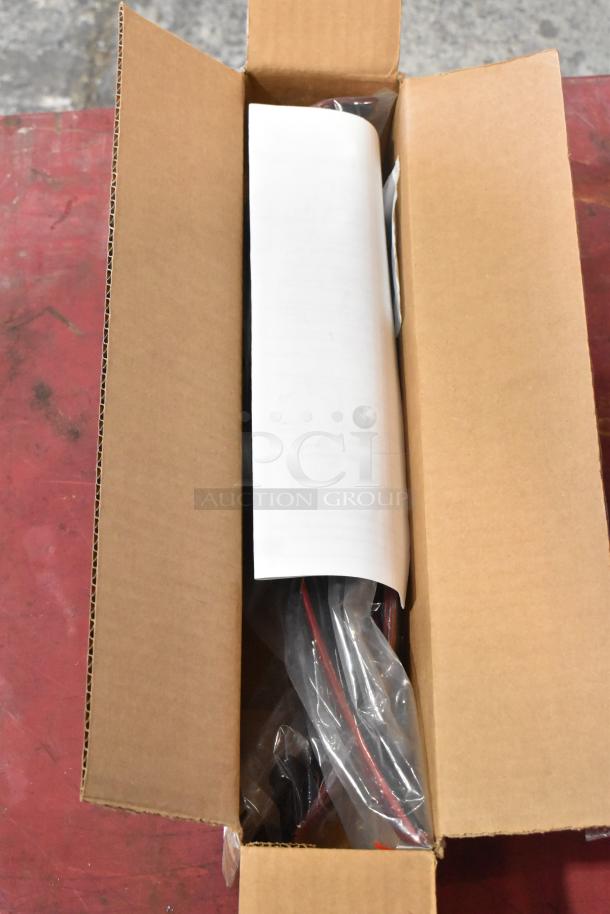 Open cardboard box with four assorted items, including a GM 23360288 wiper blade, in new condition with visible packaging.