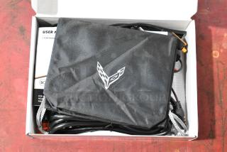 GM 85530676 Battery Tender for C6, C7, C8 Corvettes, with cords and user manual in box. Includes logo pouch. New condition.