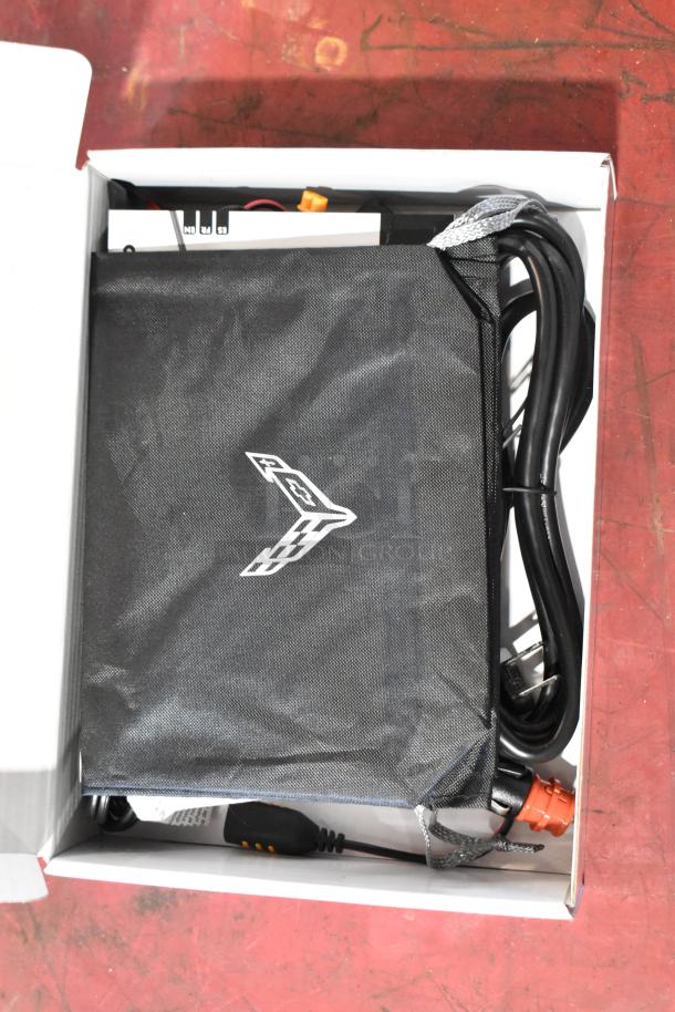 GM 85530676 battery tender for C6-C8 Corvettes in box, includes cords and Corvette logo bag, GM Accessories.