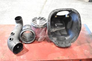 Set of 4 automotive parts including a 997-951F filter, air intake tube, and Roush intake box. New condition.