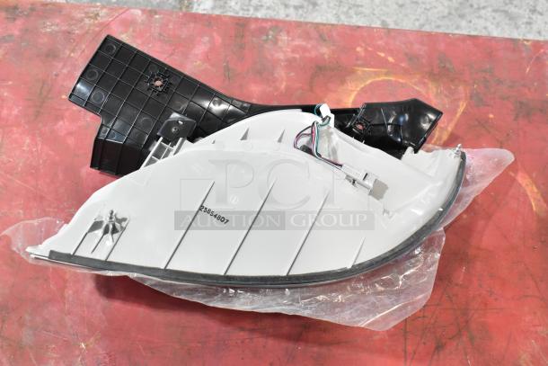 Two brake lights, new condition, with visible wiring and connector. Model number 25854807 marked on the surface.