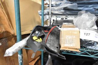 Six assorted items including Z71 Off Road emblems, packaging visible, various conditions, lot number 127.