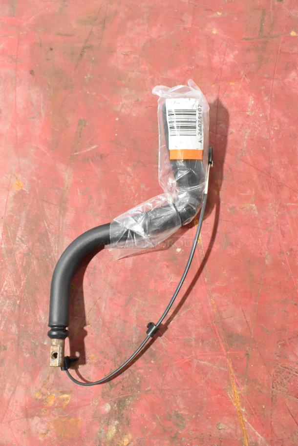 GM 22751230 door latch release switch in packaging on a red surface. Includes GM 20959449 stabilizer shaft clamp.