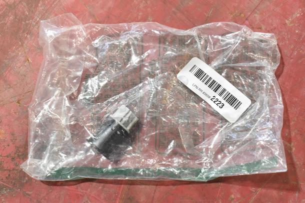 7 various items including GM 22751230 Door Latch Release Switch in plastic packaging with barcode label.