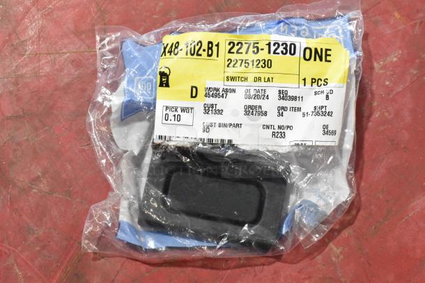 GM 22751230 Door Latch Release Switch in original packaging, label showing "SWITCH DR LAT" and part details.
