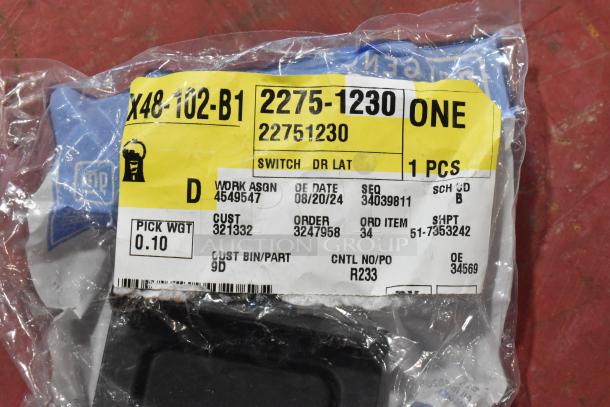 GM 22751230 door latch release switch in sealed packaging with label details. Part of a lot with multiple items. 