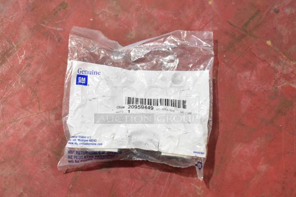 Set of 7 GM parts, includes GM 20959449 rear suspension clamp. New in original packaging, genuine GM label visible.