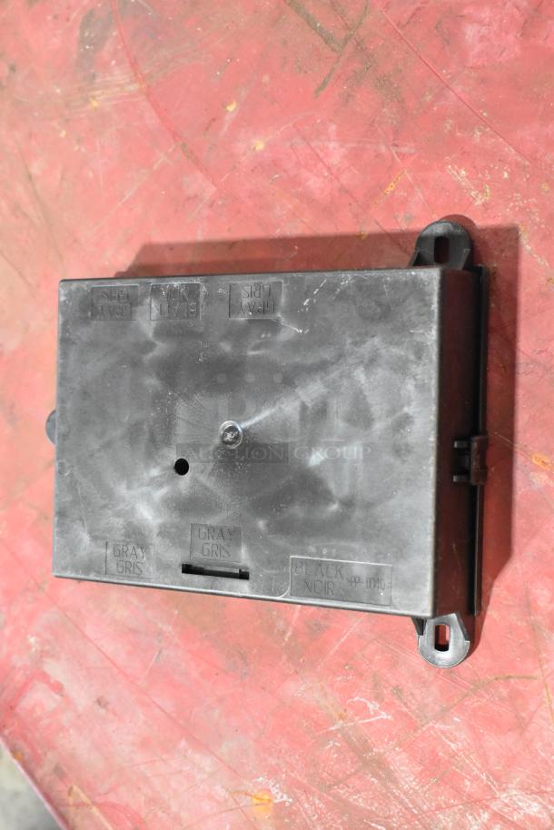 Assorted GM auto parts including GM 22751230 door latch switch. Visible markings: "GRAY, BLACK". Good condition.