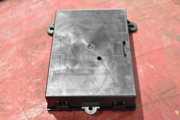 Various automotive parts, including GM 22751230 door latch release switch. Black plastic, labeled for wiring colors.