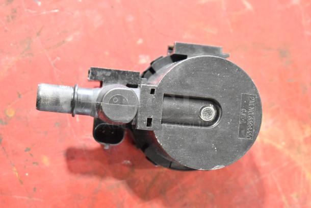 7 various items including GM 22751230 door latch release switch, visible labeling indicates GM part no. 6599950.