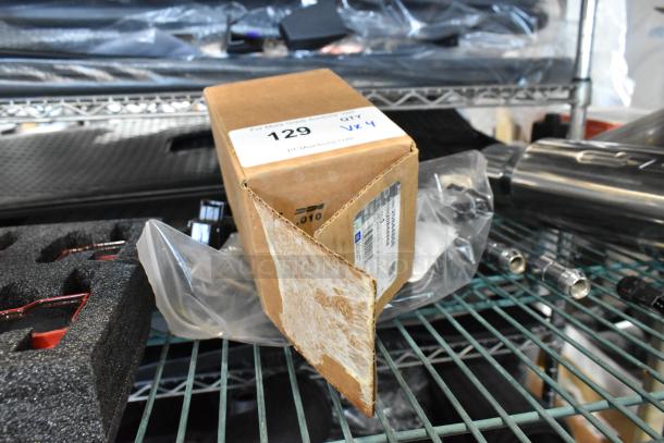 Cardboard box with GM 20844868 switch, labeled "129" and "QTY VX4" on a metal shelf, with packaging materials visible.