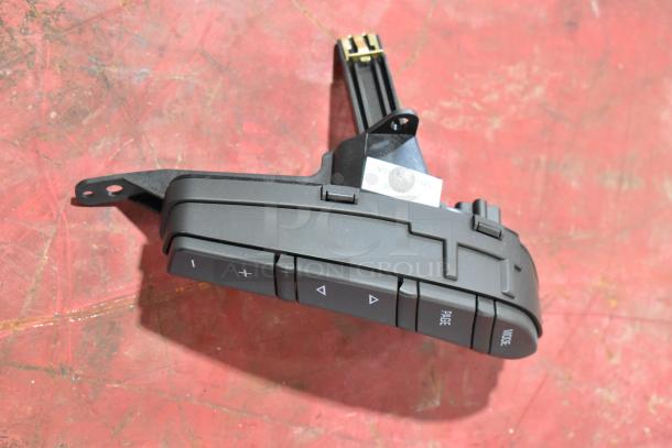 GM 20844868 switch with buttons labeled "Page" and "Mode," black plastic, made in USA, good condition.