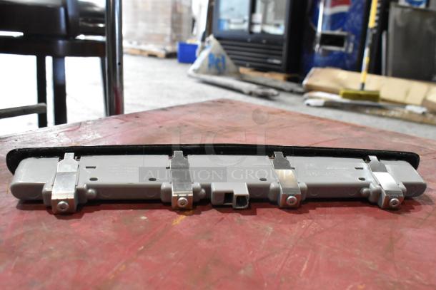 Alt text: GM 20844868 Switch with metal brackets on a table; features include markings "13.5V 2.3W" and part number 330490.
