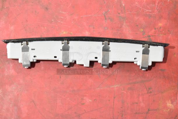 GM 20844868 switch detail, showing metal clips and markings for 13.5V, 2.3W. Item condition appears used, no labels visible.