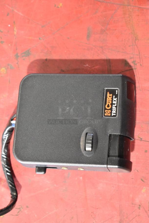 Curt Triflex brake controller, black, with logo visible, used condition. Includes GM 20844868 switch, boosting auction value.