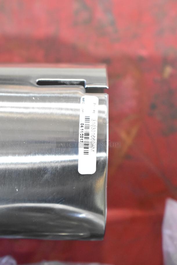 Silver metal exhaust piece with a barcode label showing "P/N: 3110301660AM, 04/11/2017." Potential auction item.
