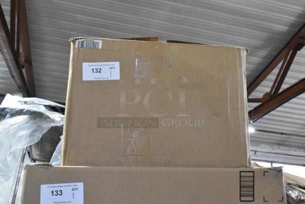 A sealed cardboard box labeled "132 QTY 1" from PCI Auctions, containing assorted parts, showing slight wear.