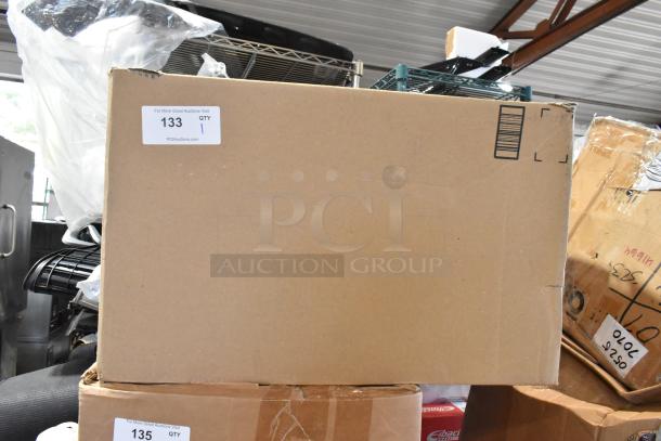 Cardboard box with filter parts, labeled "133 QTY 1" from PCI Auctions. Box appears intact, ready for auction.