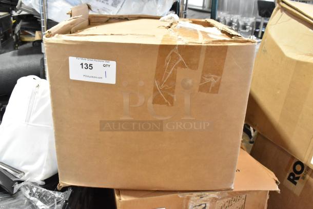 Box of parts labeled "135" from PCIAuctions.com. Contains a filter and other components. Box shows wear and tape.