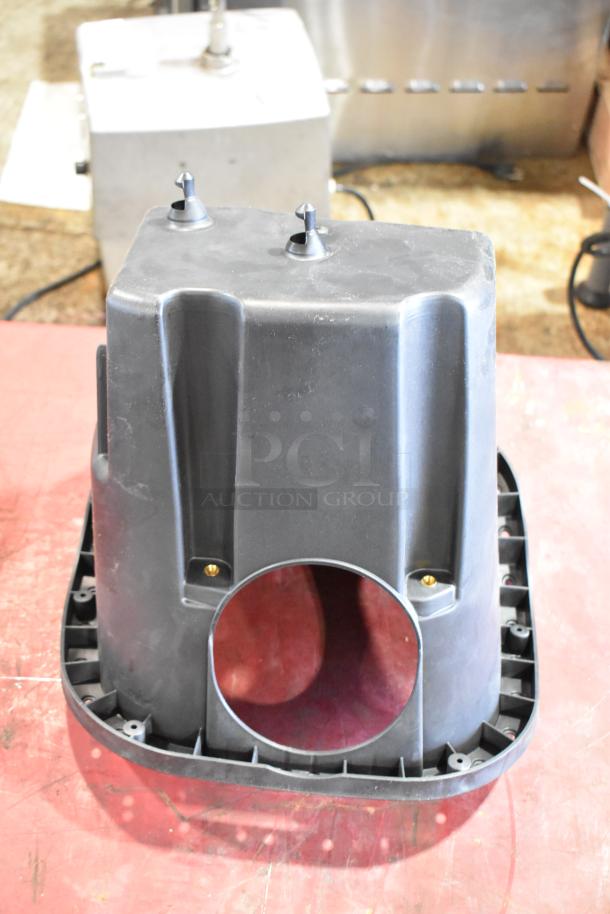 Plastic component part with circular opening, suitable for filter housing. In good condition, includes mounting points.