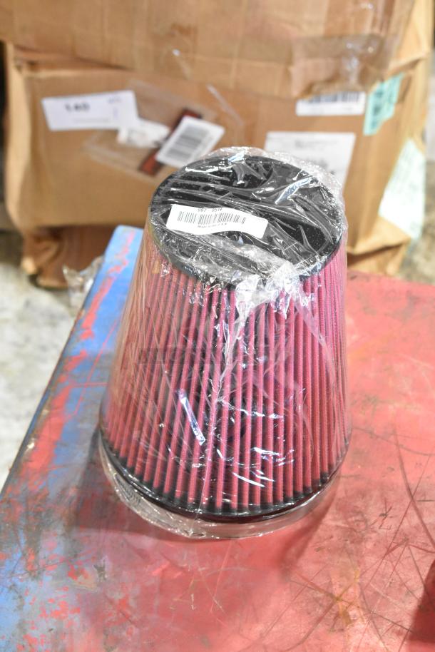 Box containing 1115TT-CAKHWKB-AA cold air intake kit, including filter wrapped in plastic, barcode visible.